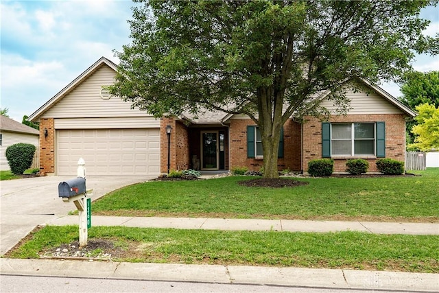 1360 Adamsmoor Dr, Waynesville, OH 45068 - view of front of property featuring concrete driveway, a garage, brick siding, and a front lawn