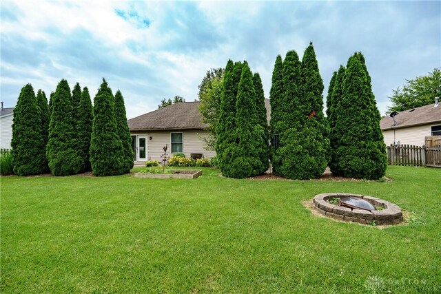 1360 Adamsmoor Dr, Waynesville, OH 45068 - view of yard with an outdoor fire pit and a vegetable garden