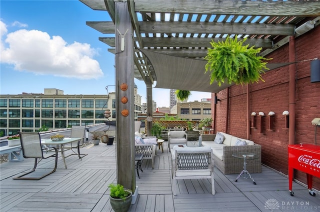 18 S Saint Clair St Unit 203, Dayton, OH 45402 - wooden deck with an outdoor hangout area and a pergola