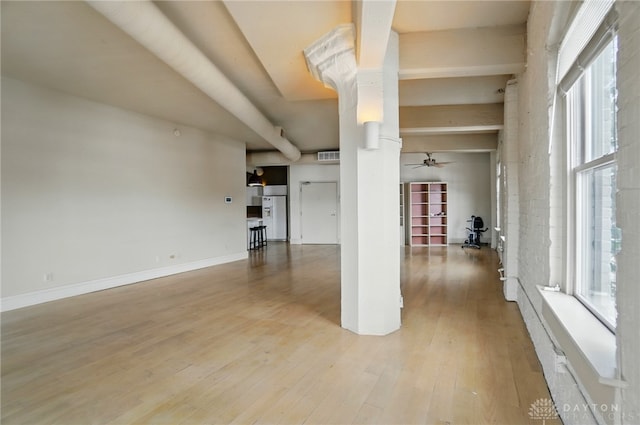 18 S Saint Clair St Unit 203, Dayton, OH 45402 - unfurnished living room with wood finished floors, decorative columns, and ceiling fan