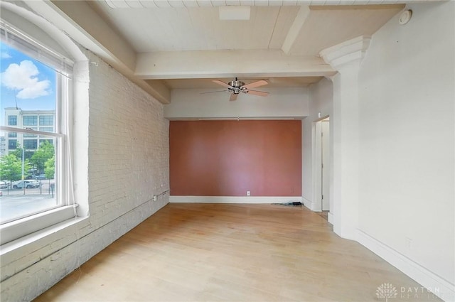 18 S Saint Clair St Unit 203, Dayton, OH 45402 - unfurnished room featuring brick wall, light wood-style flooring, a ceiling fan, beamed ceiling, and a smoke detector