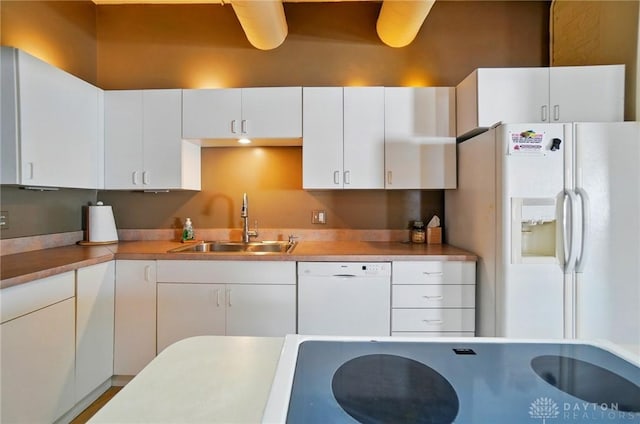 18 S Saint Clair St Unit 203, Dayton, OH 45402 - kitchen with white appliances, white cabinets, and light countertops