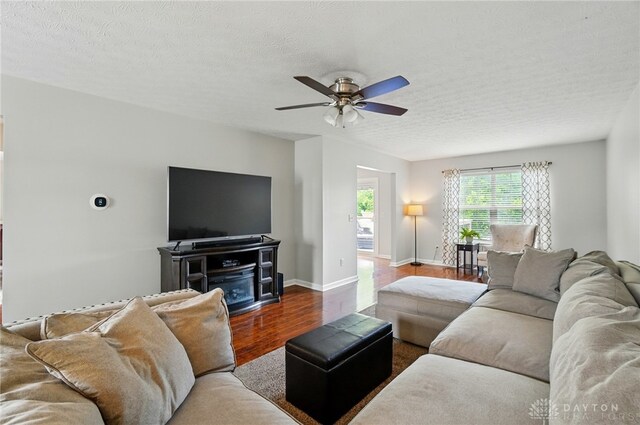1510 Ash Ridge Ct, Vandalia, OH 45377 - living area featuring wood finished floors, ceiling fan, and a textured ceiling