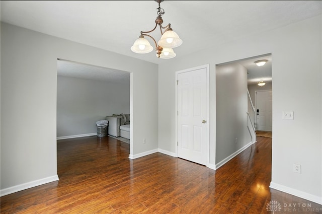 1510 Ash Ridge Ct, Vandalia, OH 45377 - empty room with a chandelier and wood finished floors