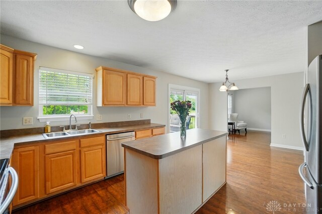 1510 Ash Ridge Ct, Vandalia, OH 45377 - kitchen featuring appliances with stainless steel finishes, a kitchen island, dark wood-style floors, recessed lighting, and a chandelier