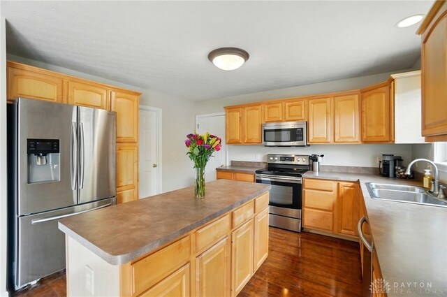 1510 Ash Ridge Ct, Vandalia, OH 45377 - kitchen featuring stainless steel appliances, light brown cabinets, dark wood-style flooring, and a kitchen island