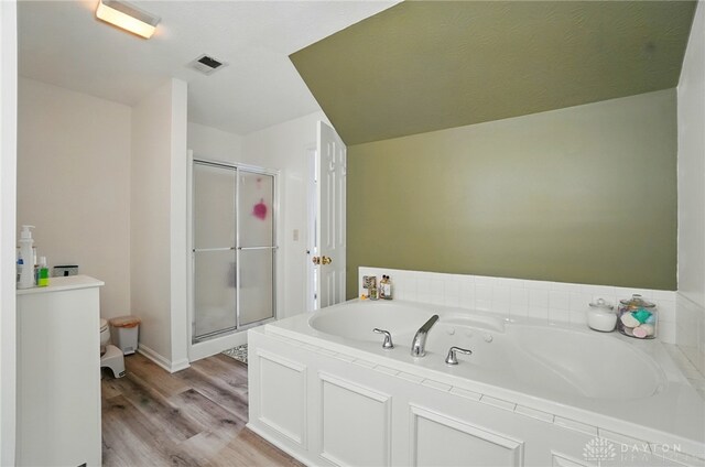 1510 Ash Ridge Ct, Vandalia, OH 45377 - full bathroom featuring a shower stall, a bath, and wood finished floors