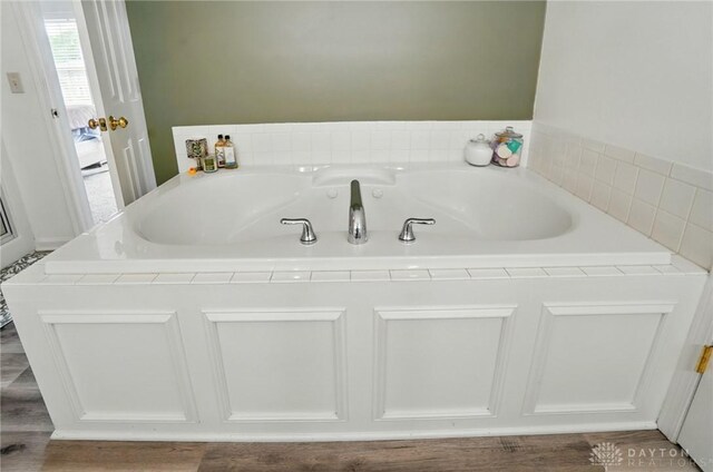 1510 Ash Ridge Ct, Vandalia, OH 45377 - bathroom with a bath and wood finished floors