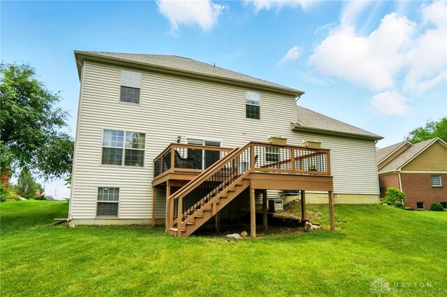 1510 Ash Ridge Ct, Vandalia, OH 45377 - back of house featuring stairway, a wooden deck, and a lawn