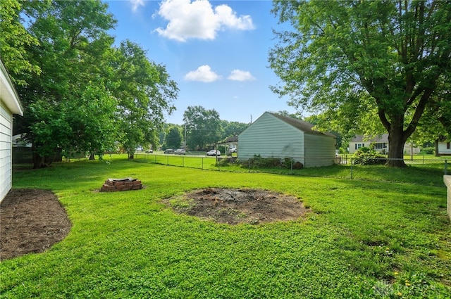 2003 Lowell St, Middletown, OH 45042 - fenced backyard featuring an outdoor fire pit