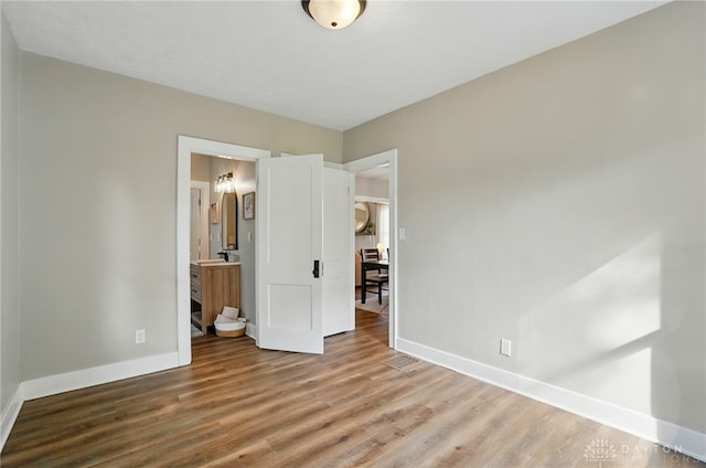 2003 Lowell St, Middletown, OH 45042 - unfurnished bedroom with wood finished floors and ensuite bathroom