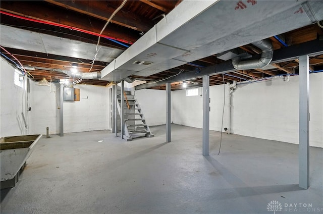 2003 Lowell St, Middletown, OH 45042 - basement featuring electric panel, stairs, and plenty of natural light