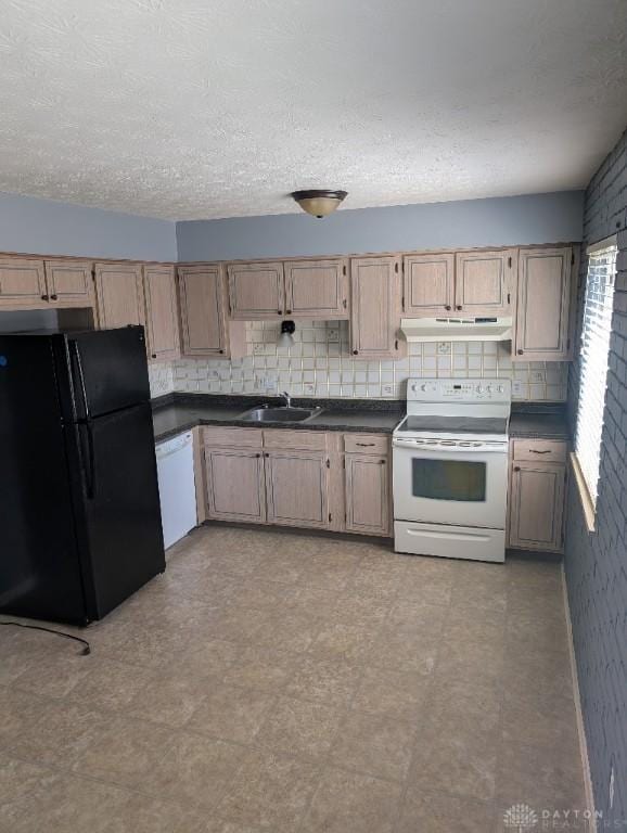 5660 Coach Dr Unit C, Dayton, OH 45440 - kitchen featuring white appliances, dark countertops, under cabinet range hood, decorative backsplash, and light flooring