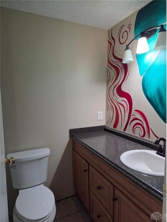 5660 Coach Dr Unit C, Dayton, OH 45440 - bathroom with vanity, a textured ceiling, and tile patterned floors