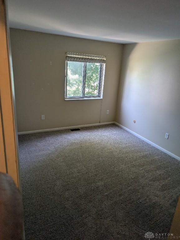 5660 Coach Dr Unit C, Dayton, OH 45440 - spare room with carpet flooring and baseboards
