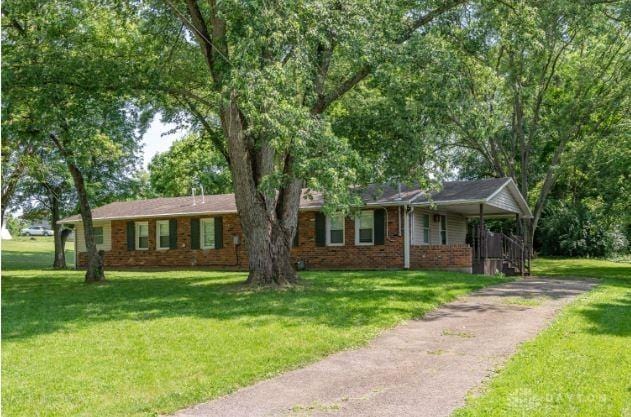 7293 Ellenridge Dr, Franklin, OH 45005 - single story home with asphalt driveway, a front yard, brick siding, and covered porch