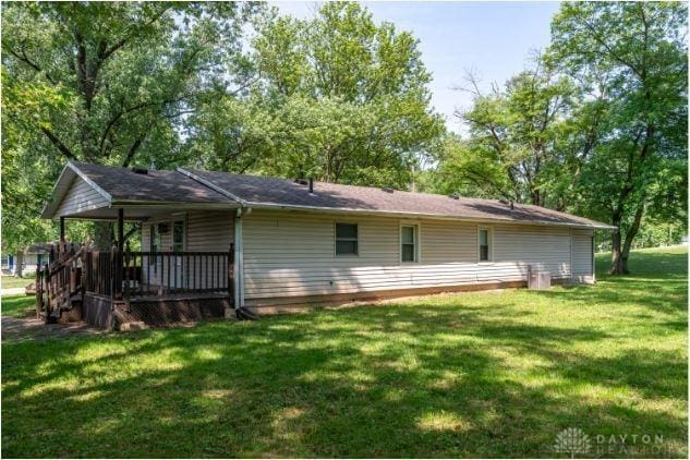 7293 Ellenridge Dr, Franklin, OH 45005 - rear view of house featuring a yard and covered porch
