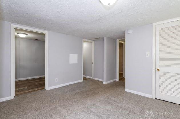 7293 Ellenridge Dr, Franklin, OH 45005 - empty room with carpet floors and a textured ceiling