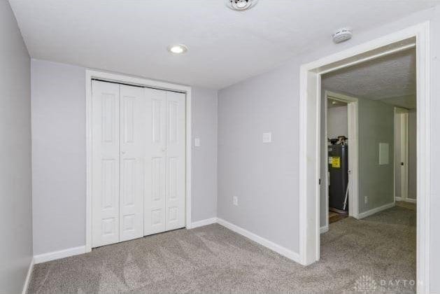 7293 Ellenridge Dr, Franklin, OH 45005 - unfurnished bedroom with carpet floors, a closet, and recessed lighting