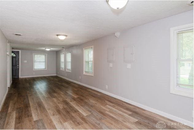 7293 Ellenridge Dr, Franklin, OH 45005 - empty room with a textured ceiling and wood finished floors