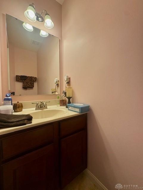 6460 Woodcreek Dr, Middletown, OH 45042 - bathroom with vanity and baseboards