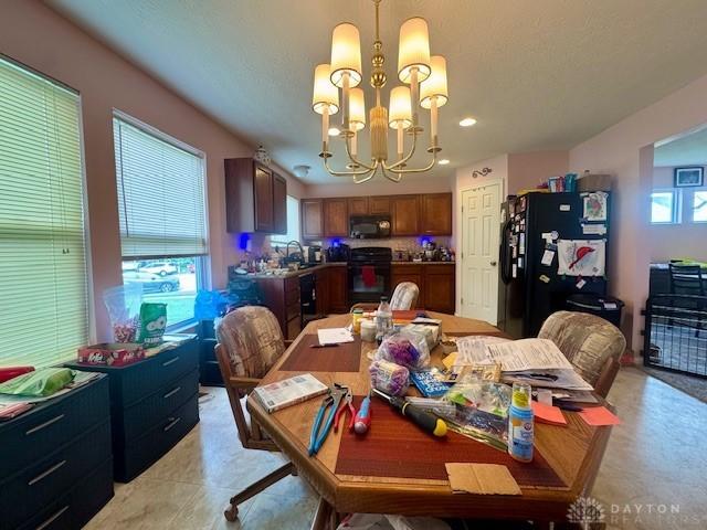 6460 Woodcreek Dr, Middletown, OH 45042 - dining room featuring a chandelier and recessed lighting