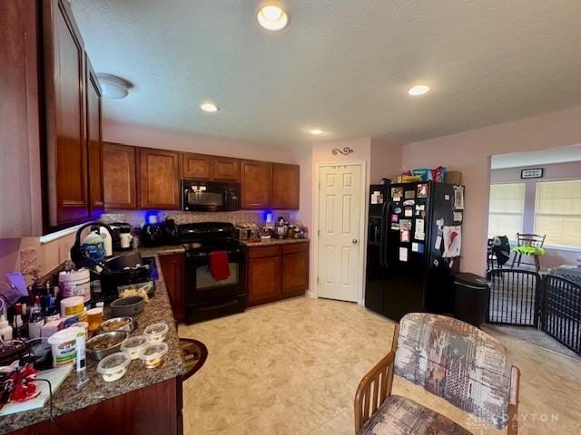 6460 Woodcreek Dr, Middletown, OH 45042 - kitchen with black appliances, brown cabinetry, and recessed lighting