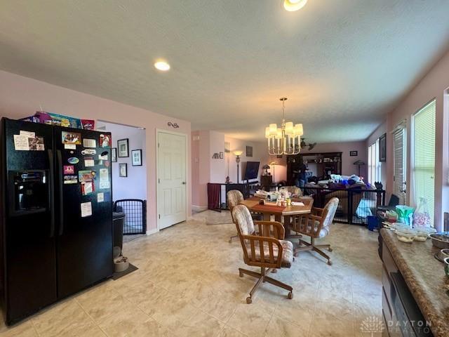 6460 Woodcreek Dr, Middletown, OH 45042 - dining area featuring a chandelier