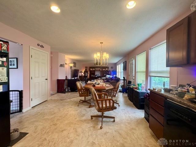 6460 Woodcreek Dr, Middletown, OH 45042 - dining area featuring a chandelier and recessed lighting