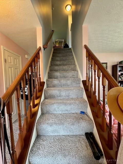 6460 Woodcreek Dr, Middletown, OH 45042 - stairs featuring baseboards and carpet