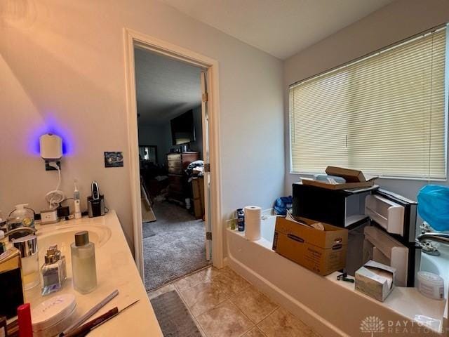 6460 Woodcreek Dr, Middletown, OH 45042 - bathroom featuring a bath and tile patterned floors