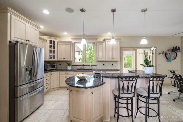 337 Yorkshire Ln, Beavercreek Twp, OH 45385 - kitchen with stainless steel fridge with ice dispenser, plenty of natural light, light tile patterned floors, and recessed lighting