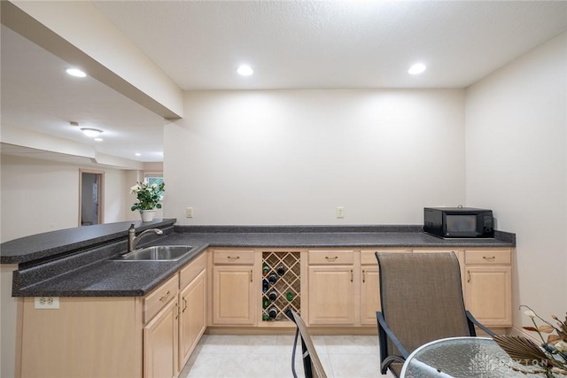 337 Yorkshire Ln, Beavercreek Twp, OH 45385 - kitchen featuring black microwave, light brown cabinetry, dark countertops, recessed lighting, and a peninsula