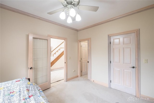 337 Yorkshire Ln, Beavercreek Twp, OH 45385 - bedroom featuring ornamental molding, light colored carpet, a ceiling fan, and french doors