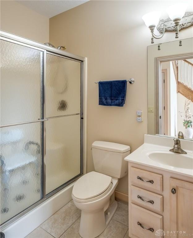 337 Yorkshire Ln, Beavercreek Twp, OH 45385 - bathroom with tile patterned flooring, vanity, and a shower stall