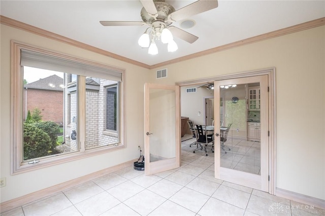 337 Yorkshire Ln, Beavercreek Twp, OH 45385 - spare room with french doors, crown molding, ceiling fan, and light tile patterned floors