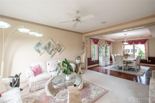 337 Yorkshire Ln, Beavercreek Twp, OH 45385 - carpeted living area with ceiling fan, crown molding, a raised ceiling, and wood finished floors