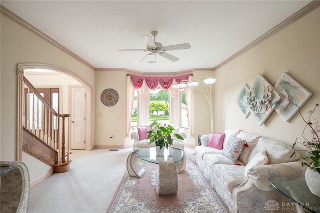 337 Yorkshire Ln, Beavercreek Twp, OH 45385 - living room featuring ceiling fan, arched walkways, carpet floors, crown molding, and stairway