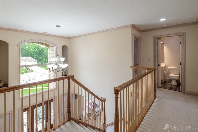 337 Yorkshire Ln, Beavercreek Twp, OH 45385 - hall with an upstairs landing, crown molding, arched walkways, and recessed lighting