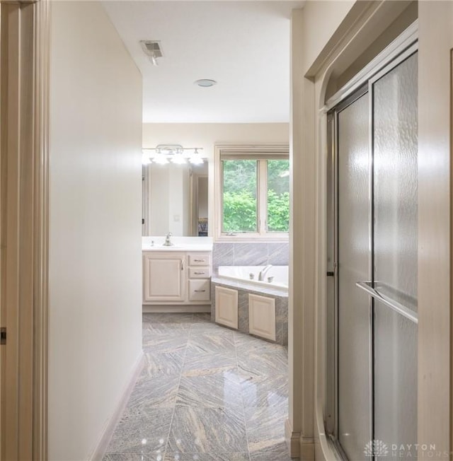 337 Yorkshire Ln, Beavercreek Twp, OH 45385 - bathroom with vanity, a bath, and a stall shower