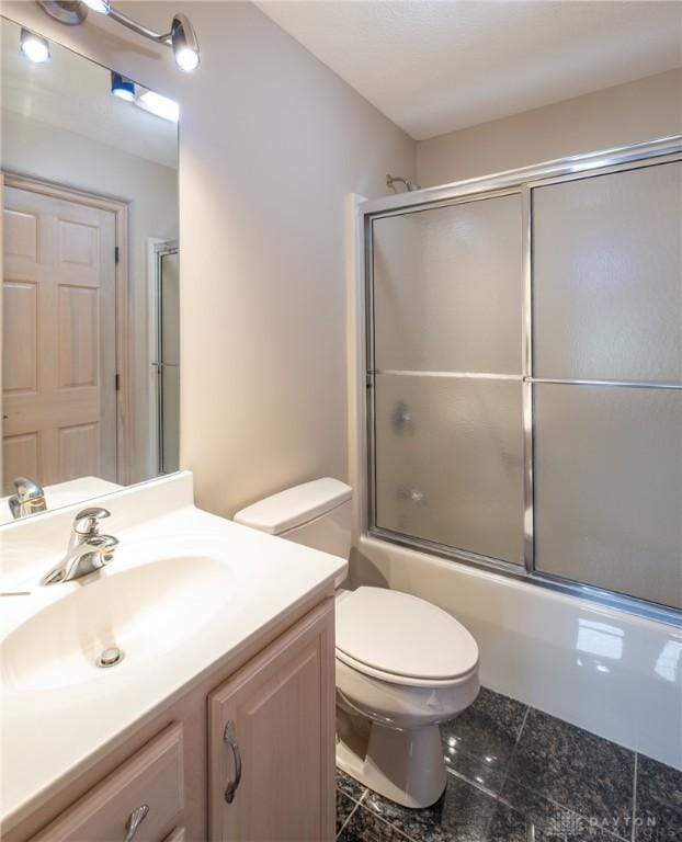 337 Yorkshire Ln, Beavercreek Twp, OH 45385 - full bathroom with vanity, combined bath / shower with glass door, and granite tiled floors