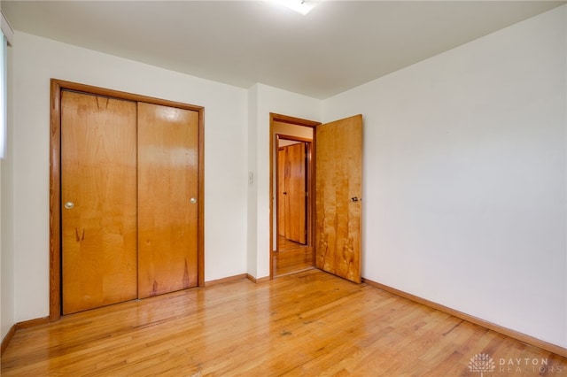 8866 Meadowlark Dr, Franklin, OH 45005 - unfurnished bedroom featuring light wood-style flooring and a closet