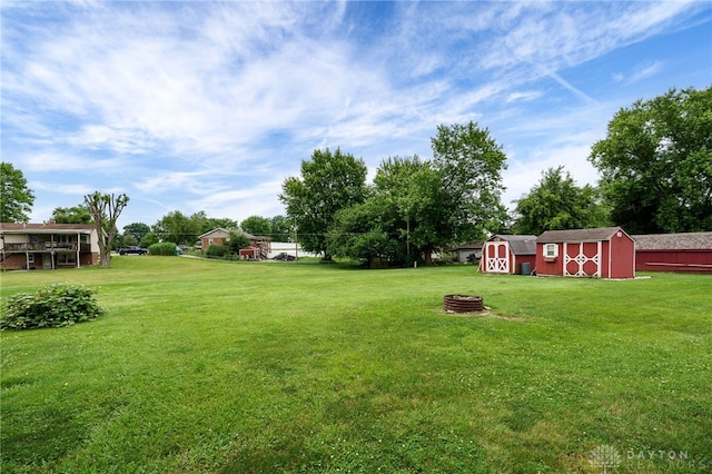 8866 Meadowlark Dr, Franklin, OH 45005 - view of grassy yard featuring a storage shed