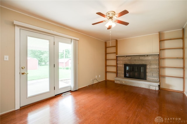 8866 Meadowlark Dr, Franklin, OH 45005 - unfurnished living room with wood finished floors, a stone fireplace, ceiling fan, and ornamental molding