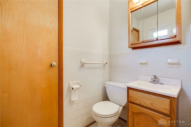 8866 Meadowlark Dr, Franklin, OH 45005 - bathroom with tile walls, vanity, and a wainscoted wall