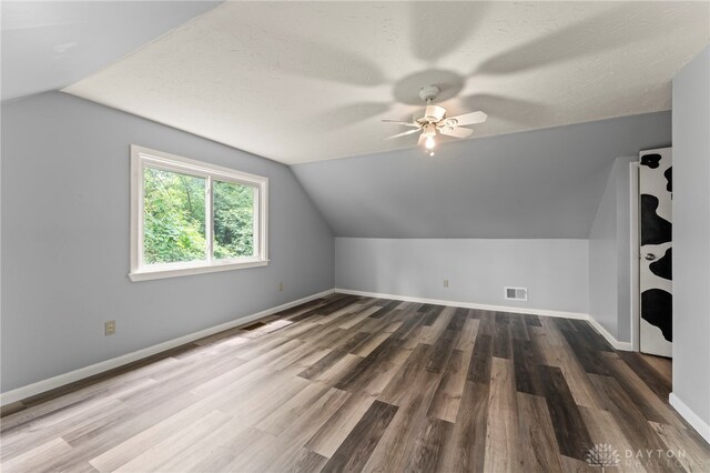 405 Hyde Park Dr, Hamilton, OH 45013 - bonus room with lofted ceiling, wood finished floors, and ceiling fan