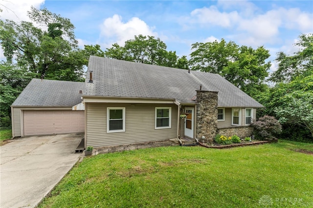 405 Hyde Park Dr, Hamilton, OH 45013 - view of front of house with driveway, an attached garage, a front lawn, stone siding, and a chimney