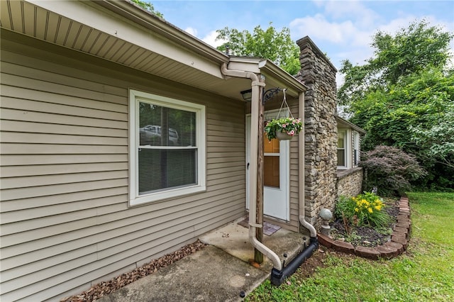 405 Hyde Park Dr, Hamilton, OH 45013 - doorway to property featuring a chimney and stone siding