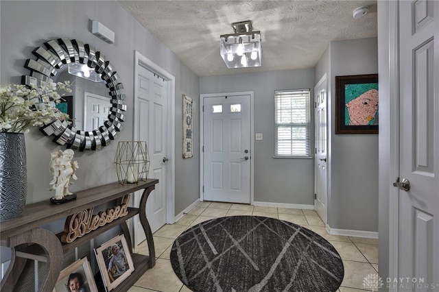 11 Green Meadow Ct, Franklin, OH 45005 - entryway featuring light tile patterned flooring and a textured ceiling