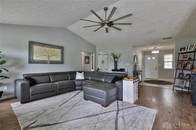 11 Green Meadow Ct, Franklin, OH 45005 - living room featuring a ceiling fan, a textured ceiling, wood finished floors, and vaulted ceiling